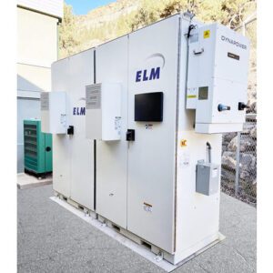 A large white electrical cabinet sitting on top of concrete.