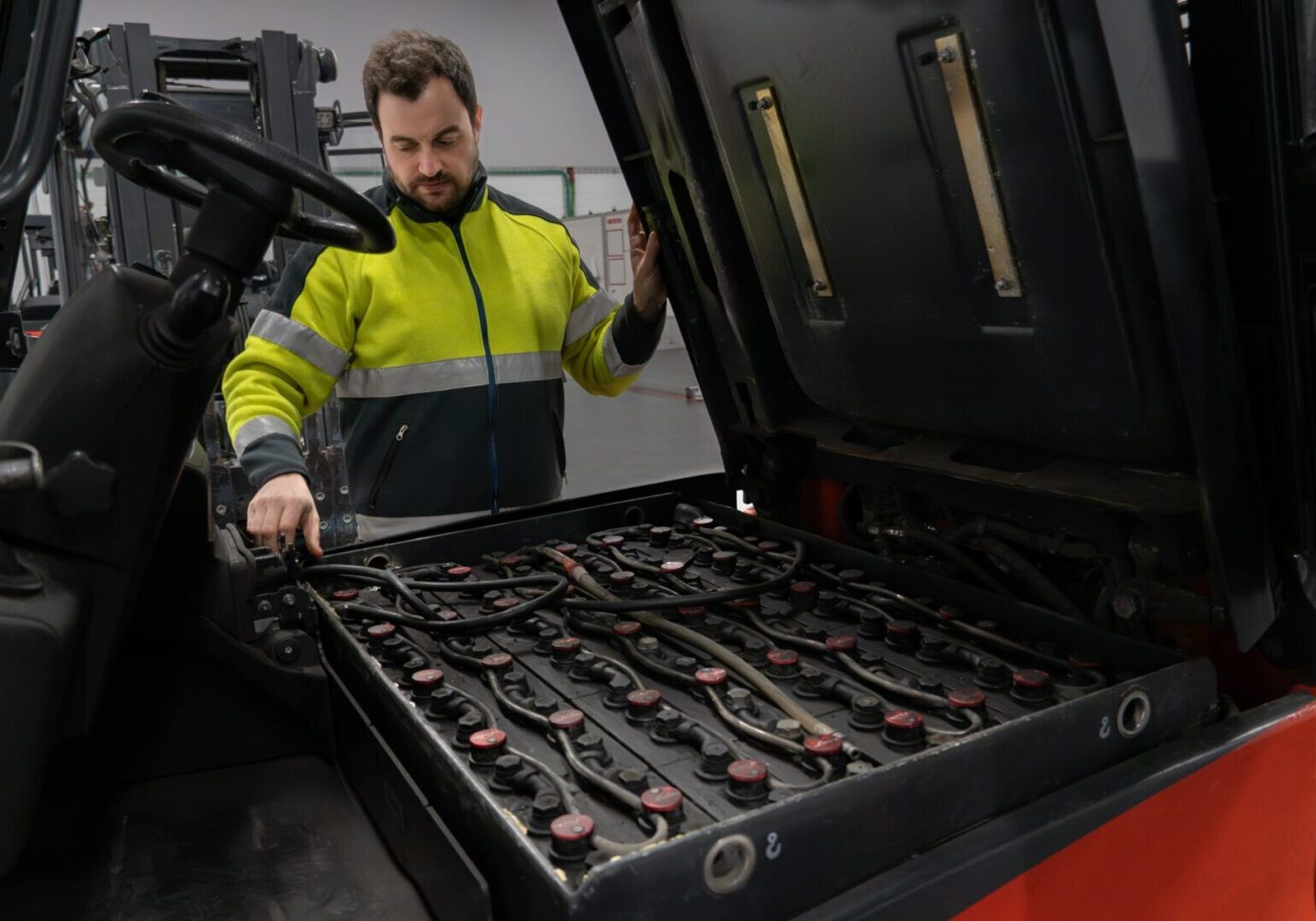 Warehouse,Manager,Preparing,The,Forklift,Battery,For,Its,Change